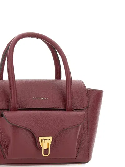 Coccinelle Double Beat Medium Leather Bag In Burgundy
