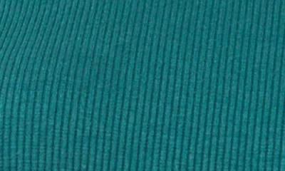 Cece Rib Knit Puff Sleeve Turtleneck Top In Green