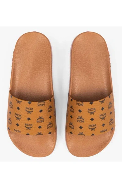 Mcm Male Monogram Print Rubber Slides In Brown