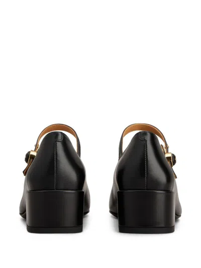 Tod's Almond Toe Block Heel Gold Hardware Pumps In Black