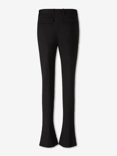 Alexander Mcqueen Tailored Wool Trousers Featuring Flared Hem In Black