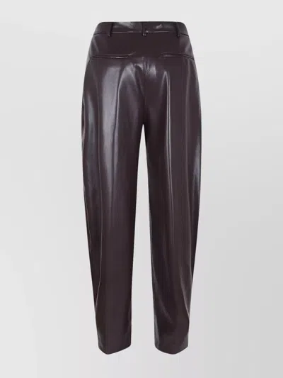 The Andamane Maxi Flare Vegan Leather Trousers In Brown