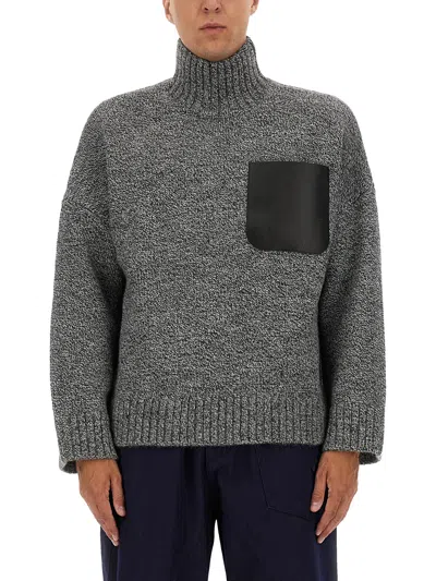 Jw Anderson Grey Sweater With High Neck And One Front Patch Leather Pocket In Wool Blend Man In Gray