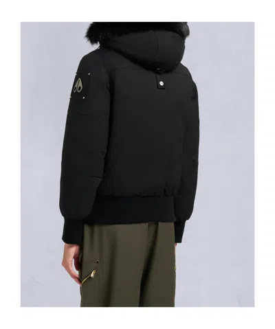 Moose Knuckles Fitted Hooded Jacket With Plush Fur Trim And Metallic Accents In Black