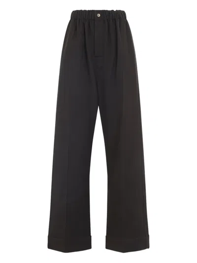 Carven Wide-leg Wool Trousers With Elastic Waistband And Buttoned Details In Black