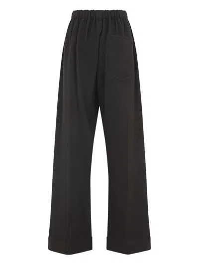 Carven Wide-leg Wool Trousers With Elastic Waistband And Buttoned Details In Black