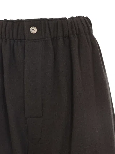 Carven Wide-leg Wool Trousers With Elastic Waistband And Buttoned Details In Black
