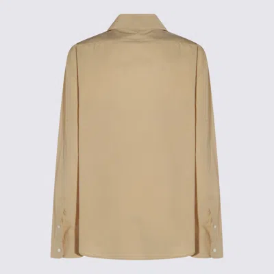 The Row Collared Long Sleeve Button Front Shirt In Sand