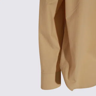 The Row Collared Long Sleeve Button Front Shirt In Sand