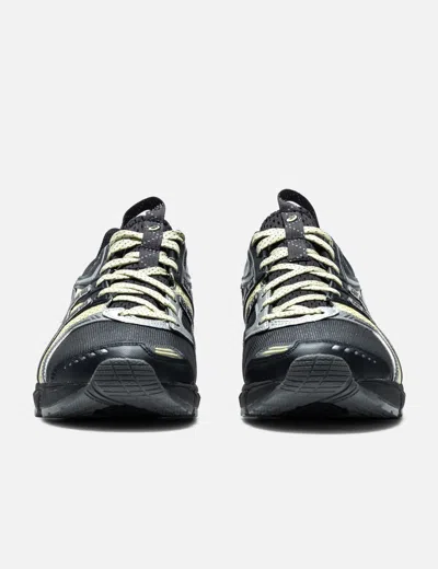 Asics Rounded Toe Sneakers With Grooved Sole And Sleek Finish In Black