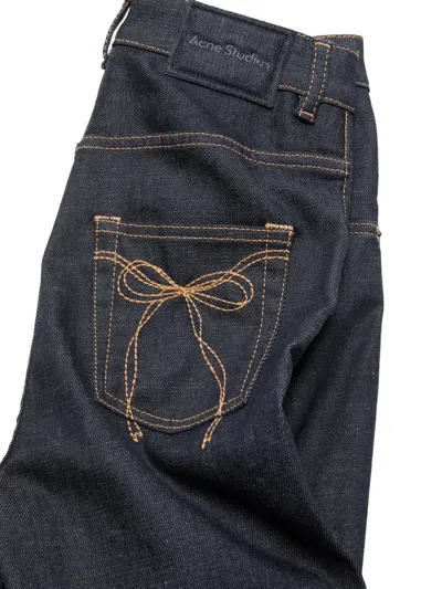 Acne Studios Bow-detail Flared Trousers In Blue