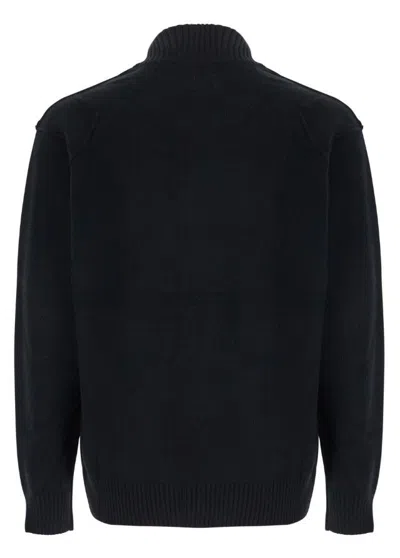 C.p. Company Black Jacket With High Neck And Logo Plaque On The Sleeve In Wool Blend Man In Black
