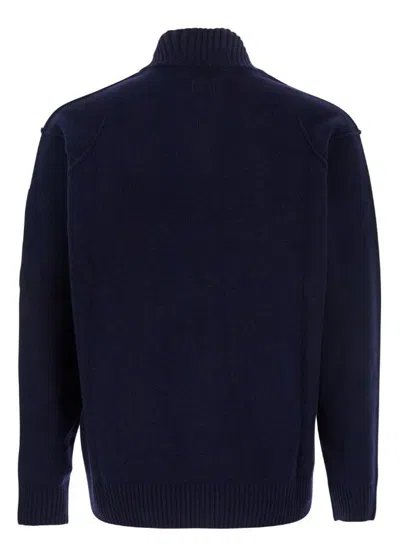 C.p. Company Blue Jacket With High Neck And Logo Plaque On The Sleeve In Wool Blend Man In Blue