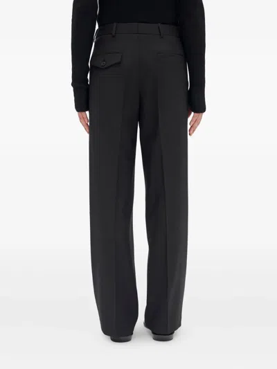Ann Demeulemeester Wrap-front Wool Pants In Black
