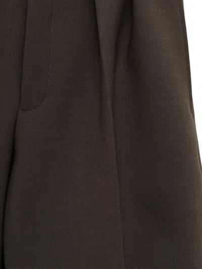 Jacquemus Pleated-front Trousers In Brown