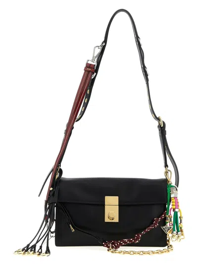 Prada Soft Sound Large Leather Shoulder Bag With Charms In Black