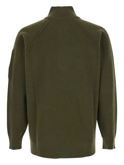 C.p. Company Men Green Turtleneck Sweater With Logo Plaque On The Sleeve In Wool Man In Green