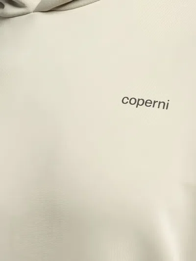 Coperni Logo-print Hoodie In Brown