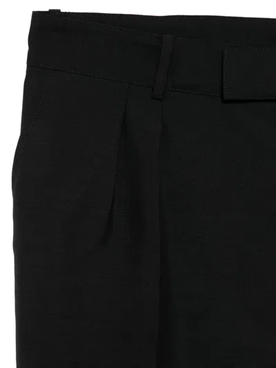 Alexander Mcqueen Pleated-front Wool Trousers In Black