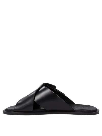 Loewe Petal Belt Cross-over Sandals In Black