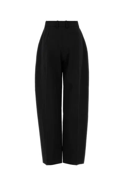Givenchy Wool Trousers With Pleated Design And Button Detail In Black
