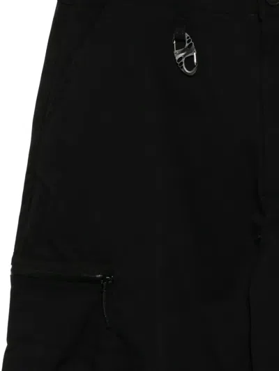 Izzue Logo-patched Trousers In Black