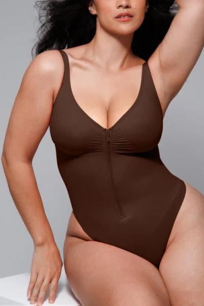 Shapellx Skin Flow Zipper Front Thong Bodysuit In Brown