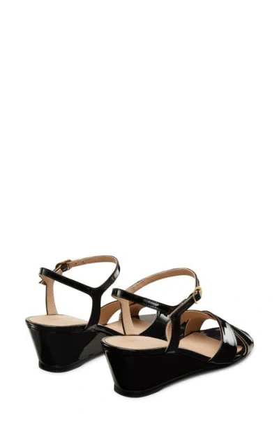 Stuart Weitzman Dayna Patent Crisscross Wedge Sandals In Black