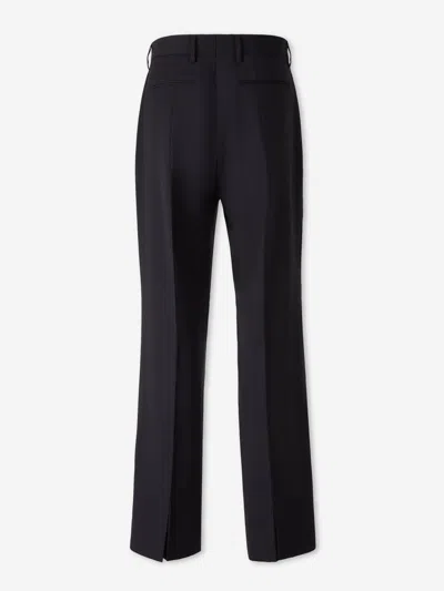 Carrer Cadore Trousers In Black