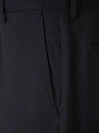 Carrer Cadore Trousers In Black