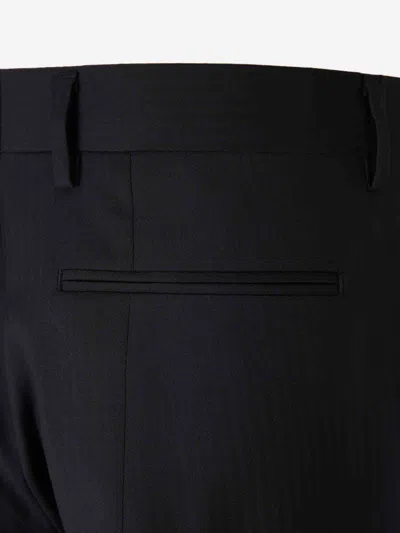 Carrer Cadore Trousers In Black