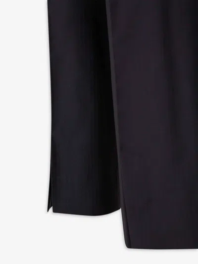 Carrer Cadore Trousers In Black