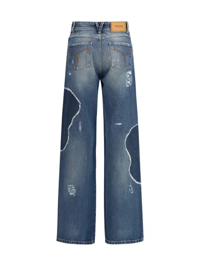 Versace Distressed Patchwork High-rise Wide-leg Jeans In Animal Print
