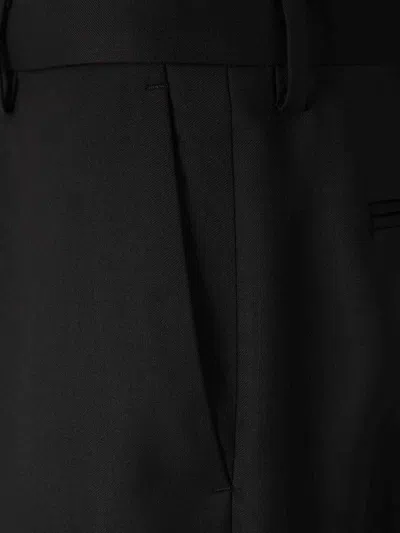 Carrer Cadore Trousers In Black