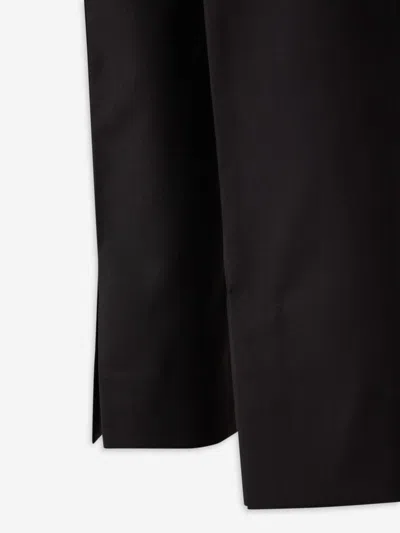 Carrer Cadore Trousers In Black