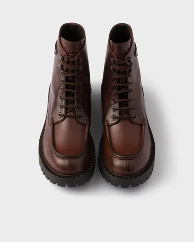 Prada Laced Leather Booties In Black