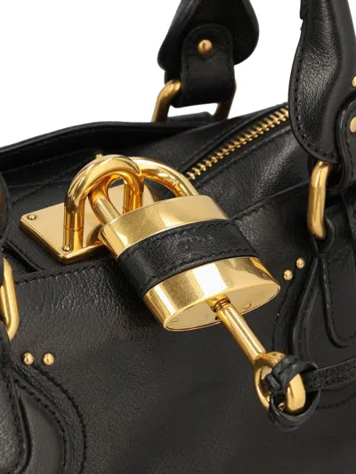 Chloé Structured Shoulder Bag With Padlock And Studs In Black