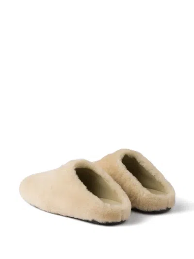 Prada Triangle-logo Shearling Mules In Neutral
