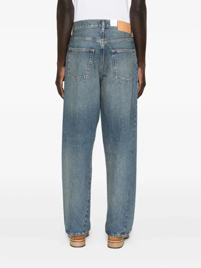 WIDE-LEG TWISTED JEANS
