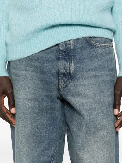 WIDE-LEG TWISTED JEANS