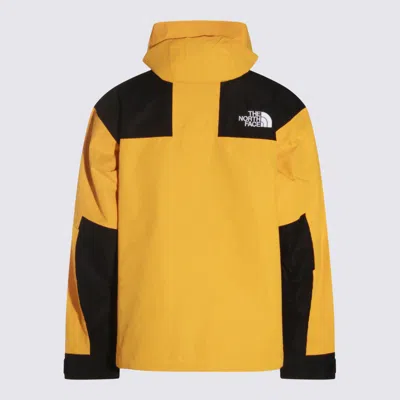 The North Face Yellow And Black Casual Jacket In Gold