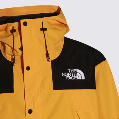 The North Face Yellow And Black Casual Jacket In Gold