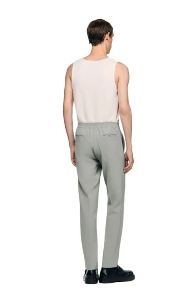 Sandro Jersey Trousers In Green