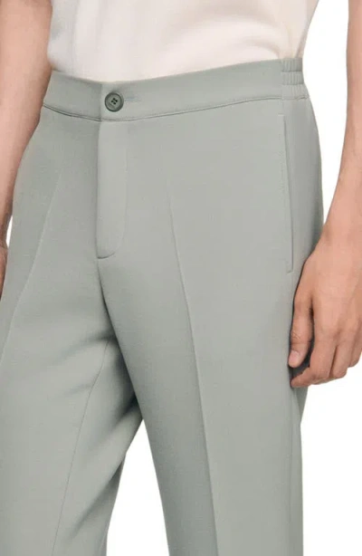 Sandro Jersey Trousers In Green