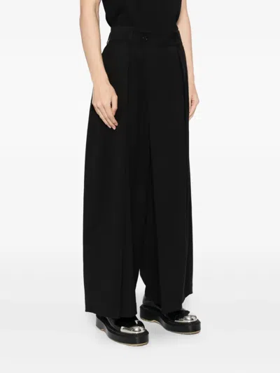 Songzio Asymmetric-wrap Trousers In Black