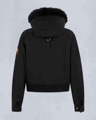 Moose Knuckles Fitted Hooded Jacket With Plush Fur Trim And Metallic Accents In Black