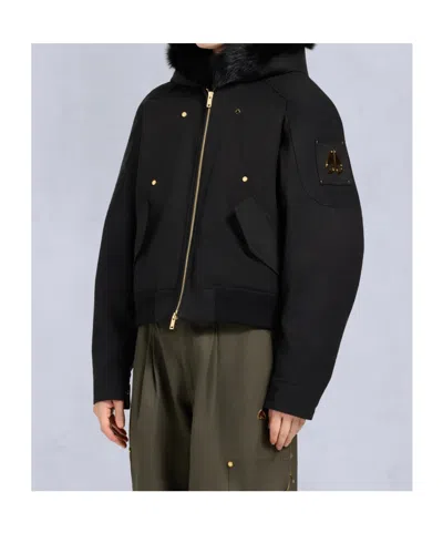 Moose Knuckles Fitted Hooded Jacket With Plush Fur Trim And Metallic Accents In Black