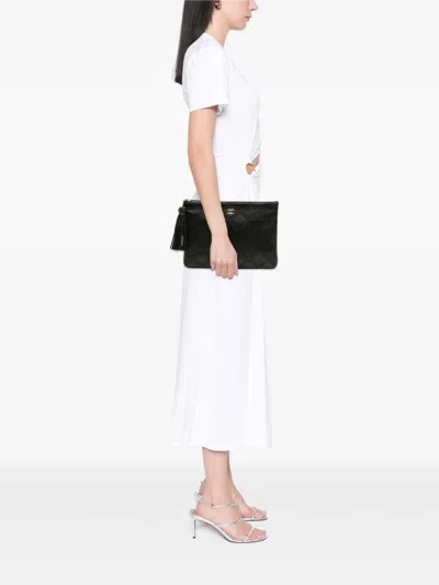 Pre-owned Chanel 2017-2018 Medium Quilted Lambskin Double Stitch Tassel O Case Clutch Bag In Black