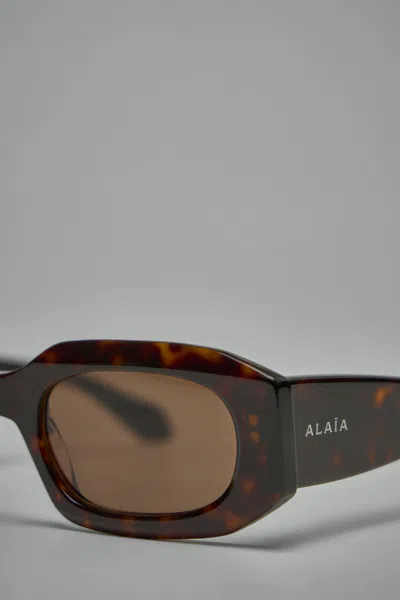Alaïa Rectangular Sunglasses In Brown