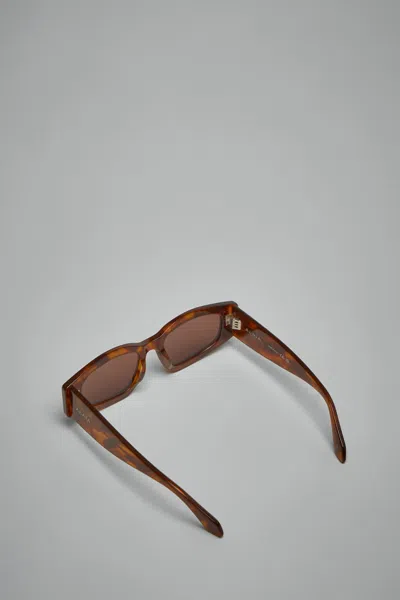 Alaïa Logo Sunglasses In Brown